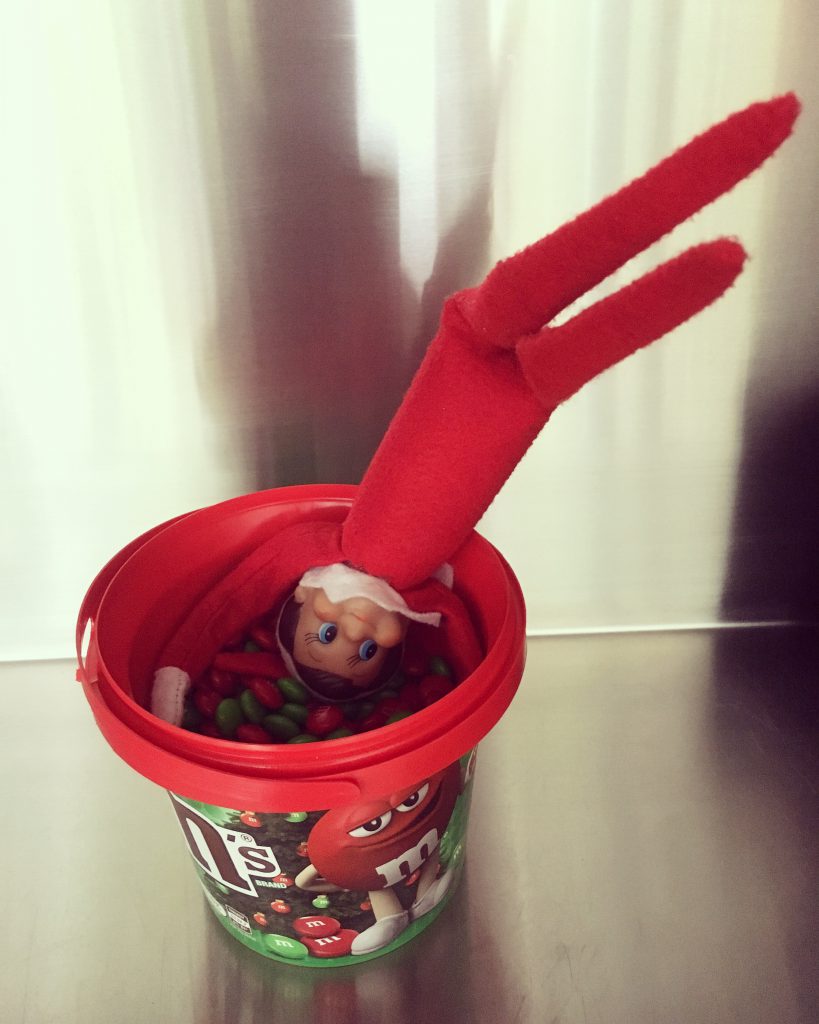 Diving head first into a bucket of festive M&M's